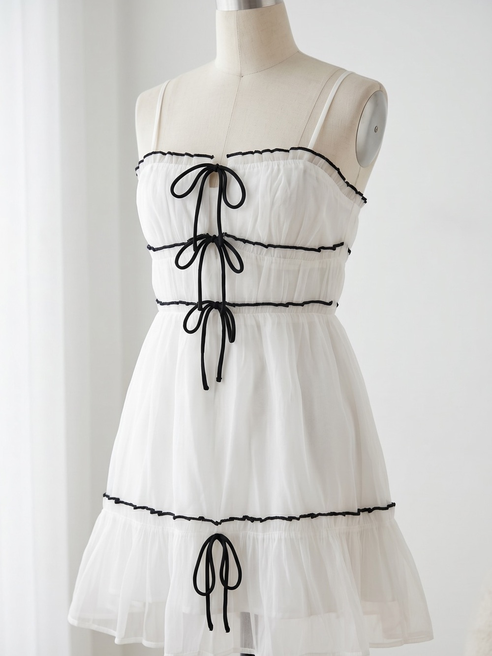 White Mini Dress with Black Trim and Tie-Front Bows